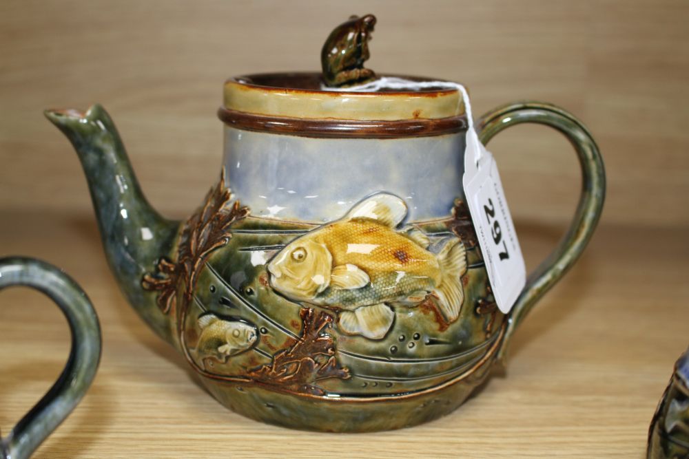A Royal Doulton fish and pond weed three-piece tea set, designed by George Tinworth, made c.1905, teapot 13cm high